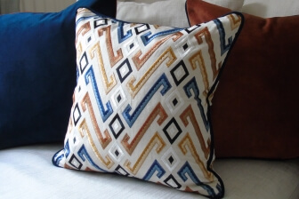 cushion in a geometric design fabric by mulberry